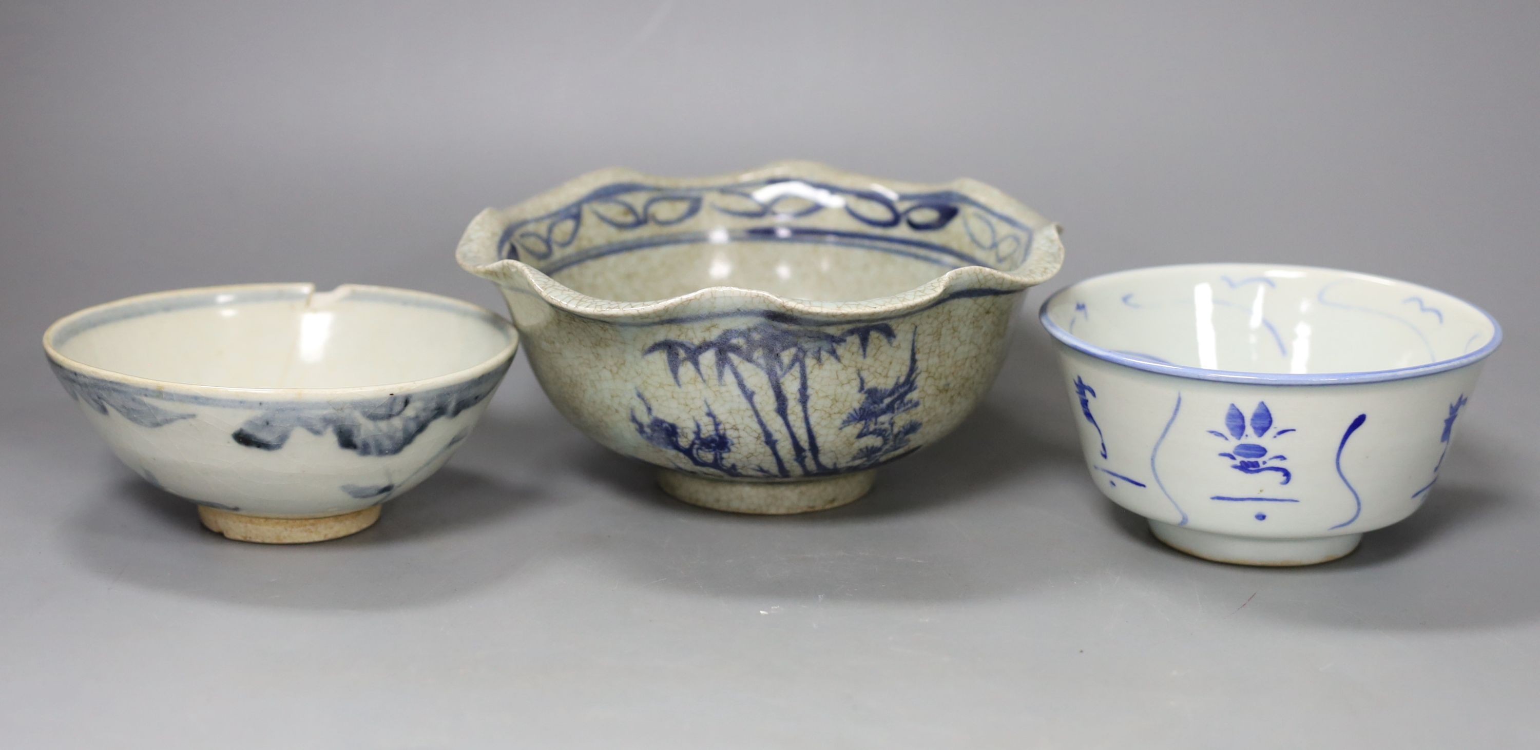 Three Chinese porcelain blue and white bowls, largest 17cm. diam.